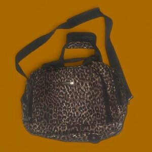 Cheetah Bag with zipper pockets & Padded adjustable strap & hard plastic bottom